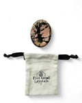 Rhodonite crystal thumb worry stone with Feel Good Crystals Ltd pouch