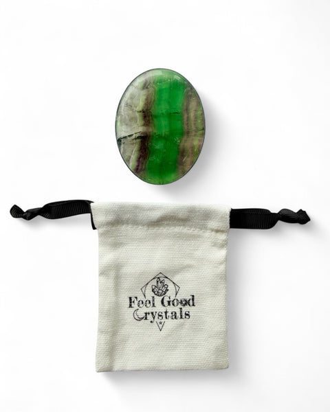 Fluorite crystal thumb worry stone with Feel Good Crystals drawstring pouch