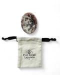 Lepidolite crystal thumb worry stone with Feel Good Crystals drawstring pouch