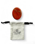 Red jasper crystal thumb worry stone with Feel Good Crystals drawstring pouch