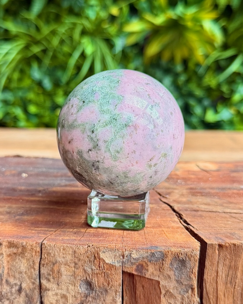 polished pink opal sphere with inclusions
