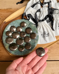 pyrite crystal coin with drawstring bag