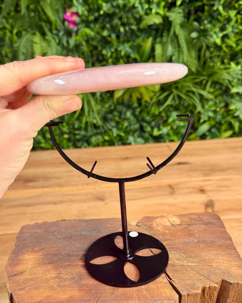 Bi carving held on its side in rose quartz 