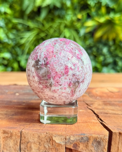 mixed coloured crystal sphere on stand