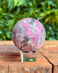 pink & purple crystal sphere on stand