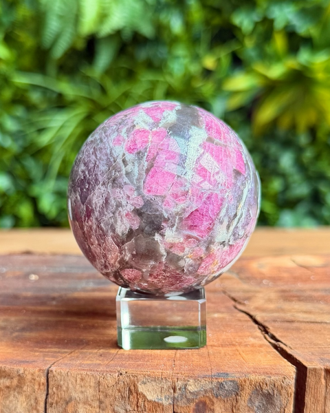 pink & purple crystal sphere on stand