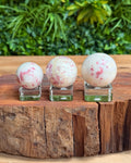 three cinnabrite crystal spheres