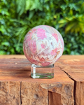 unicorn stone sphere on stand with natural background
